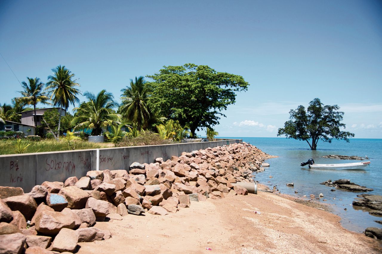 epa10297297 A sea wall lines the waterfront on Saibai Island, in the Torres Strait, Australia 02 November 2022 (issued 10 November 2022). Residents say the sea wall isn't high enough to stop high tides during the Monsoon season and some streets and houses still flood. Islanders from Torres Strait, the body of water between Australia and Papua New Guinea, are travelling to the United Nations Climate Change Conference (COP27) to urge the global community to act on climate change in a bid to save their home from rising sea levels. EPA/AARON BUNCH AUSTRALIA AND NEW ZEALAND OUT