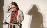 Lydia Davis of U.S. with the trophy makes a speech after winning the Man Booker International Prize at an award ceremony in London, Wednesday, May 22, 2013. The Man Booker International Prize is awarded every two years to a living author who has published fiction either originally in English or whose work is available in translation in the English language. (AP Photo/Sang Tan)