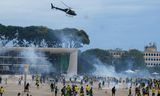 Schermutselingen tussen ordetroepen en Bolsonaro-aanhangers bij het presidentiële Planalto-paleis in Brasília.