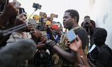 Jimmy ‘Barbecue’ Chérizier, nu bendeleider van de ‘G9’ tijdens een persconferentie, dinsdag, in Port-au-Prince.