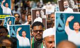 Aanhangers van de Congress-partij demonstreren in New Delhi tegen de veroordeling van oppositiepoliticus Rahul Gandhi. 