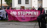 Demonstranten bij de rechtbank in Halle, bij het begin van de rechtszaak tegen AfD-voorman Björn Höcke, op 18 april. 