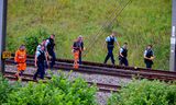 SNCF-medewerkers en agenten bij het spoor bij het noord-Franse Croisilles. 