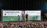 Daniel Levy spreekt tijdens  een protest bij het ministerie van Buitenlandse Zaken op 23 mei, waarbij de namen van  15.000 in Gaza omgekomen kinderen werden voorgelezen.