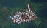 Een luchtfoto van het eiland Carti Sugtupu in Guna Yala Comarca, aan de Caribische kust in Panama. Er is geen centimeter ruimte meer over op het eilandje dat zo'n 1.200 meter ten noorden van de Noord-Panamese kust ligt. 