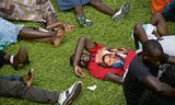 Een Rwandese man draagt een shirt met een beeltenis van de Amerikaanse president Barack Obama Foto Ben Curtis/AP