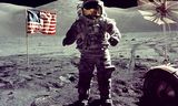 -- FILE PHOTO 19DEC72 - Astronaut Eugene Cernan walks toward the Lunar Roving Vehicle (LRV) near the U.S. flag at the Taurus-Littrow landing site of Apollo 17 on December 19, 1972.  The photograph was taken by astronaut Harrison H. Schmitt, lunar module pilot.