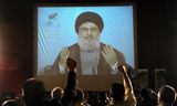 De laatste jaren zagen Libanezen de ondergedoken Hezbollah-leider Nasrallah alleen nog in videoboodschappen, zoals hier in 2012. 