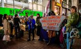 Protest door Extinction Rebellion tijdens Black Friday in Amsterdam, 2022. 