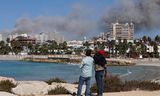 Rookwolken boven de Libanese havenstad Tyrus na de nieuwe Israëlische bombardementen woensdag.  