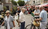 De markt in de binnenstad van Breda. De lonen zijn in Nederland harder gestegen dan de prijzen, waardoor de meeste burgers meer te besteden hebben. 