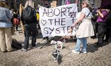 Baas in Eigen Buik demonstreert op de Dam in Amsterdam voor het recht op abortus.