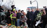 Tino Chrupalla (vierde van rechts, lichtblauwe sjaal), duovoorzitter van de AfD, in Maagdenburg, zaterdag.   