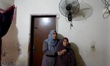 Familie van Muayyad Abu Saleh, die woont in een huis met een lekkend dak. Jerash kamp, Jordanië, 16 december 2024.
