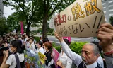 Een betoging voor het ministerie van Buitenlandse Zaken in Tokio. De demonstranten eisen een hardere aanpak van seksueel geweld door Amerikaanse militairen.    