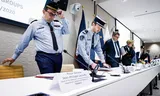Vertegenwoordigers van Frankrijk en Nederland op een persconferentie van Eurojust.