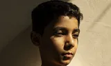 Mahmoud Ajjour, 9 jaar. De winnende foto van World Press Photo toont een Palestijnse vluchteling die zijn armen verloor in Gaza.