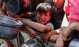 Bij een gaarkeuken in Khan Younis, in het zuiden van de Gazastrook, op 29 april. Foto Hatem Khaled