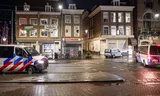Kraakpand aan het Rokin in Amsterdam. Rechts de Taksteeg, waar de krakers van Takland zitten. In juni poogden de krakers zonder succes  het pand rechts te kraken. 