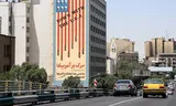 Anti-Amerikaanse muurschildering in het centrum van de Iraanse hoofdstad Teheran. Foto AFP