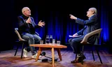 Frans Timmermans (links) wordt geïnterviewd door Ad Melkert in debatcentrum De Balie.  