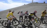 TOPSHOT - UAE Team Emirates - XRG team's Slovenian rider Tadej Pogacar wearing the overall leader's yellow jersey and Team Visma - Lease a bike team's Danish rider Jonas Vingegaard cycles in the ascent of Mont Ventoux during the 16th stage of the 112th edition of the Tour de France cycling race, 171.5 km between Montpellier and Mont Ventoux, southern France, on July 22, 2025.