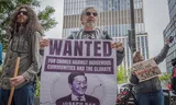Demonstranten protesteren tegen KKR in New York. De investeringsmaatschappij wordt verweten in onder meer Israël en fossiele industrie te investeren. Foto Eric McGregor 